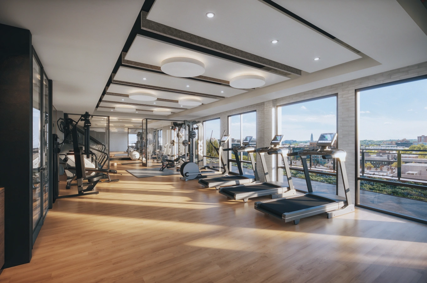 Bright fitness center with panoramic city views and advanced cardio equipment