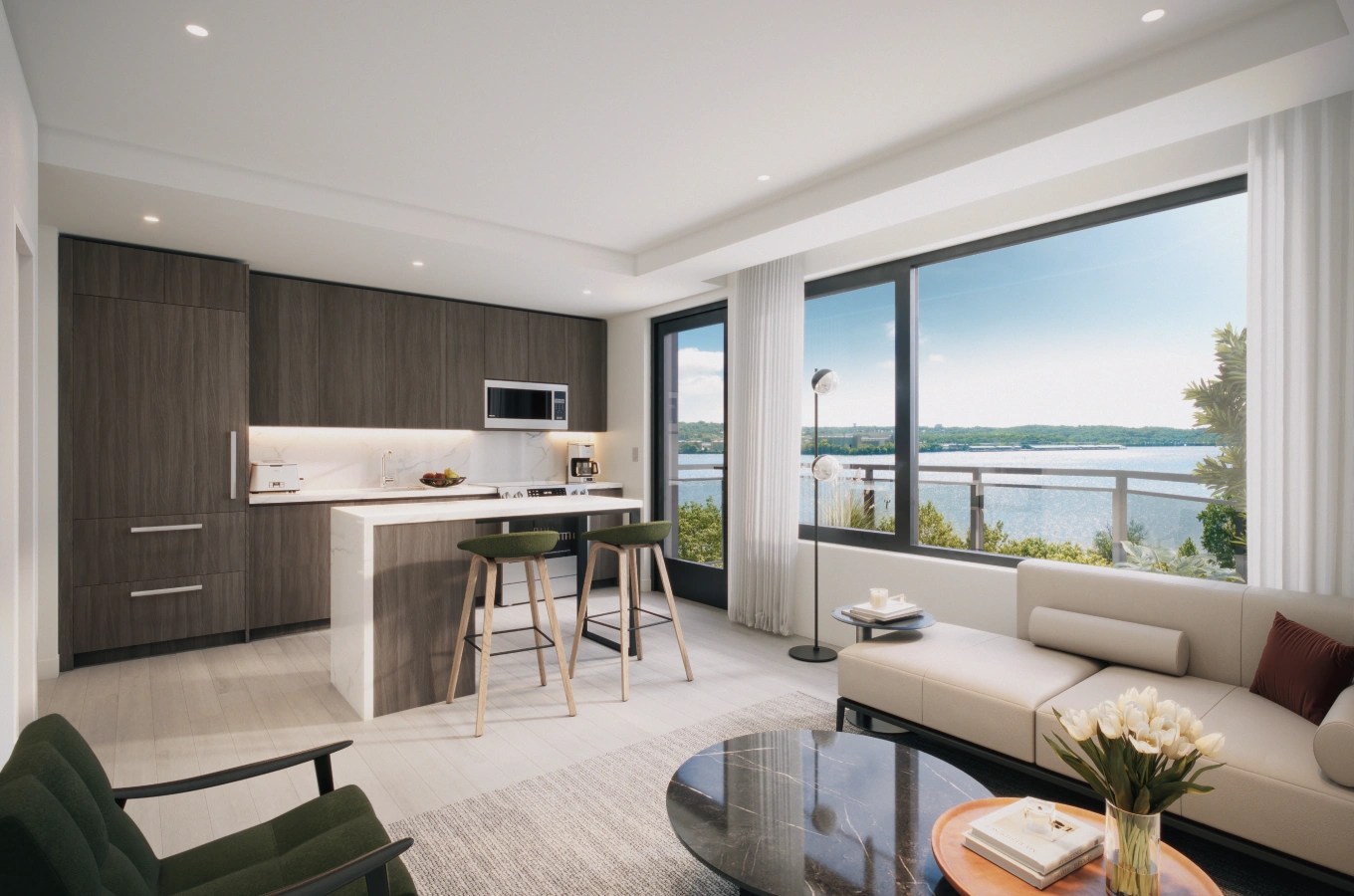 Compact apartment kitchen and lounge with waterfront views through large windows